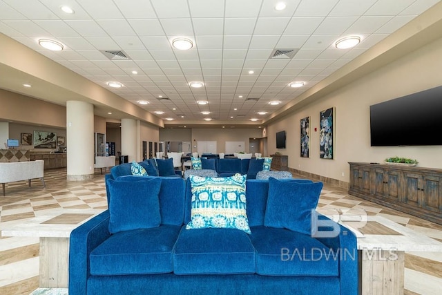 living area with recessed lighting, baseboards, visible vents, and light floors
