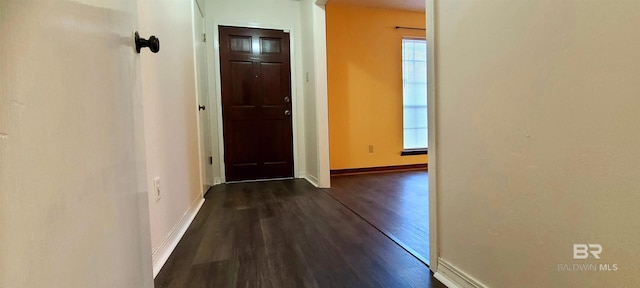 corridor featuring dark hardwood / wood-style floors