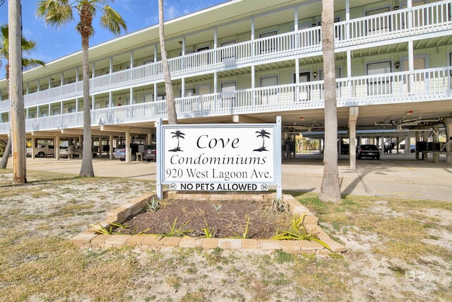 community sign with a carport