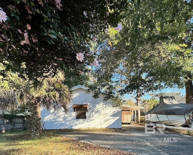 view of home's exterior with a carport