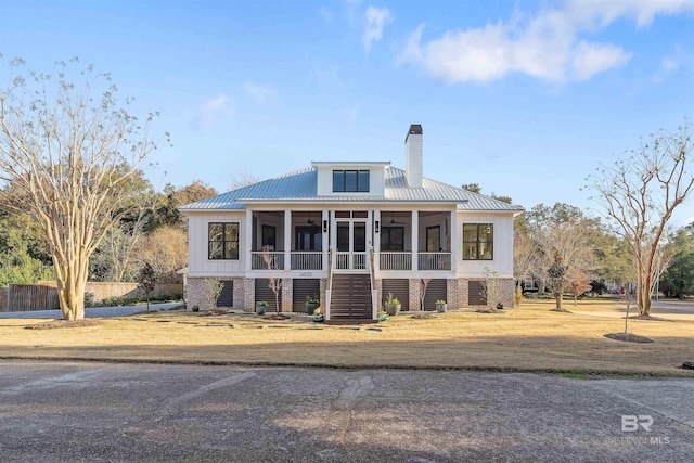 view of front of property featuring a sunroom