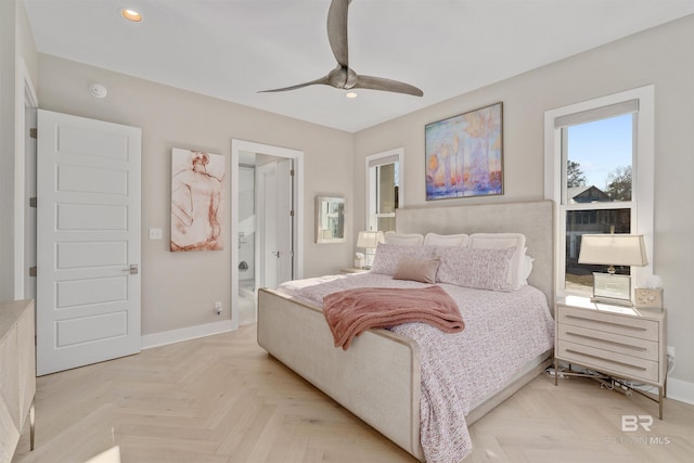 bedroom with ceiling fan, connected bathroom, and light parquet floors