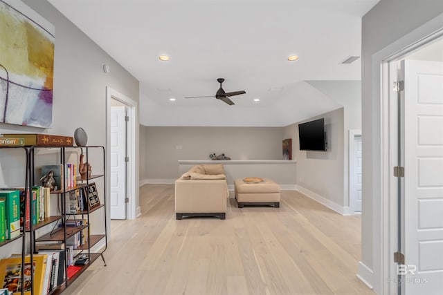 living area with ceiling fan and light wood-type flooring