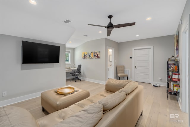 living room featuring ceiling fan, lofted ceiling, and light hardwood / wood-style floors