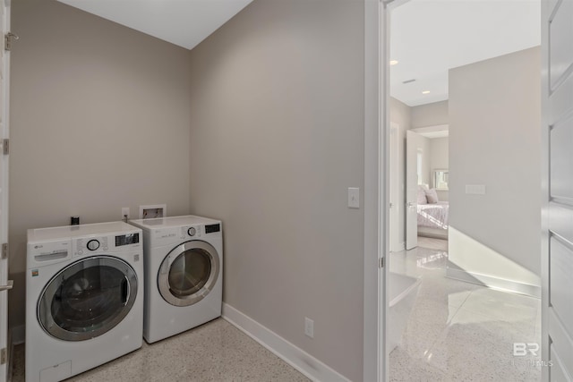 laundry room with washing machine and dryer