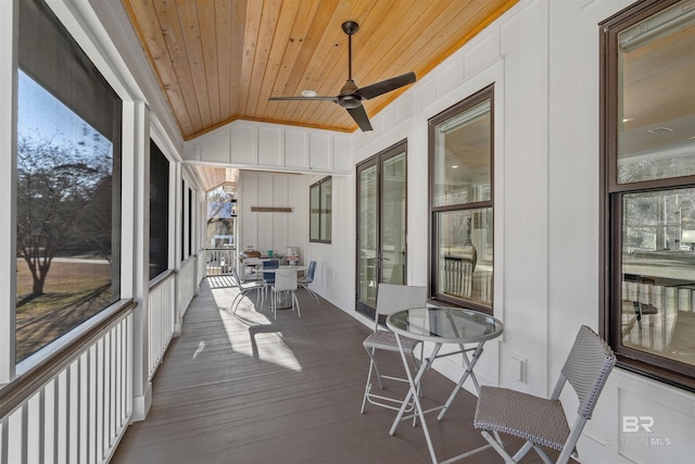 exterior space with ceiling fan, vaulted ceiling, and wooden ceiling