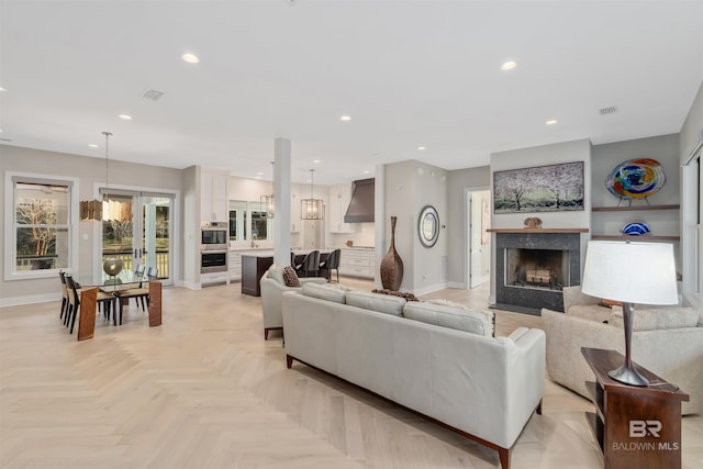 living room with french doors and light parquet floors