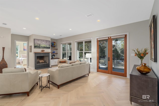 living room featuring french doors and light parquet flooring