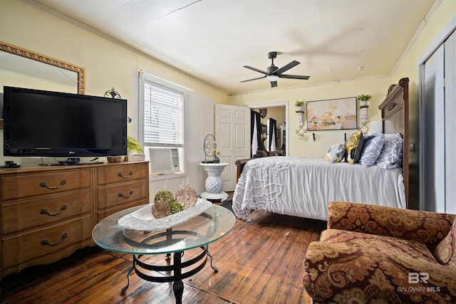 bedroom with ceiling fan, cooling unit, ornamental molding, and dark wood-type flooring