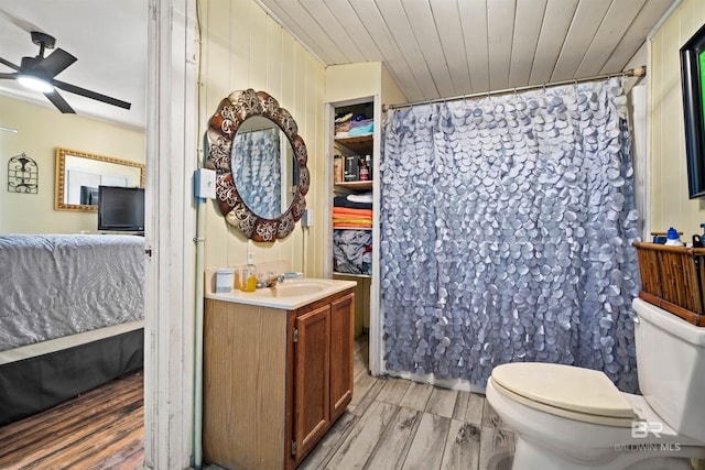 bathroom featuring wood ceiling, vanity, ceiling fan, hardwood / wood-style flooring, and toilet