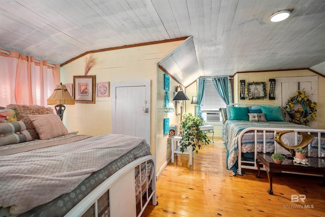 bedroom featuring lofted ceiling, hardwood / wood-style flooring, and wooden ceiling