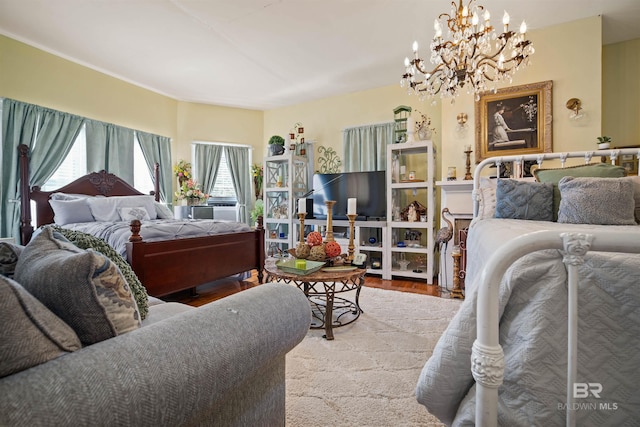 bedroom featuring a chandelier and light hardwood / wood-style flooring