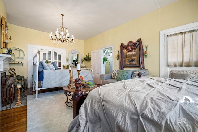 bedroom featuring light hardwood / wood-style floors and a chandelier