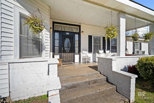 doorway to property with a porch