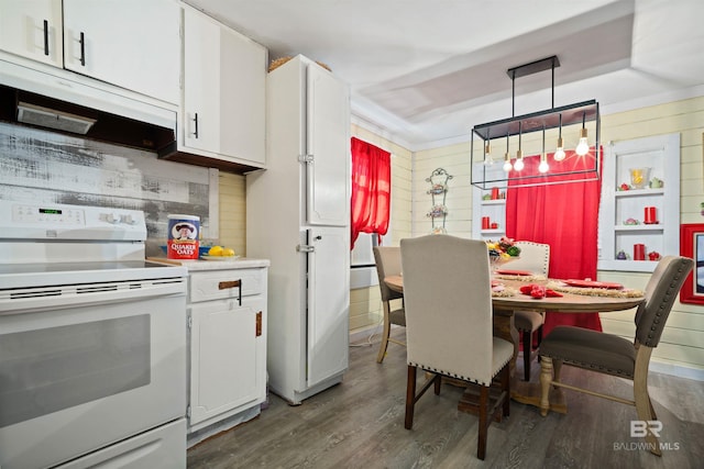 kitchen with backsplash, hanging light fixtures, white electric range oven, dark hardwood / wood-style flooring, and white cabinetry