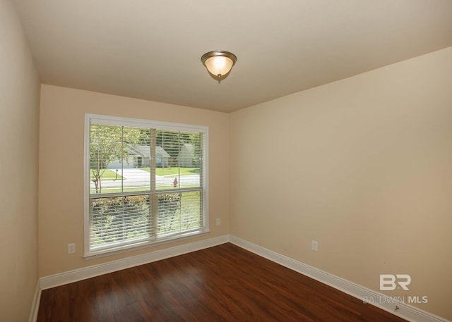 empty room featuring dark hardwood / wood-style floors