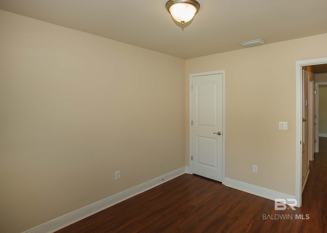 unfurnished bedroom featuring hardwood / wood-style flooring