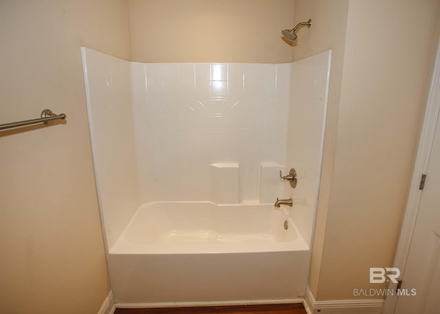 bathroom with washtub / shower combination