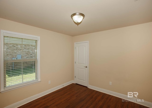 spare room with hardwood / wood-style floors