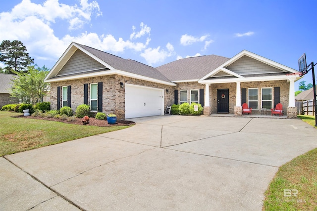 craftsman house featuring a garage, a front lawn, covered porch, brick siding, and concrete driveway