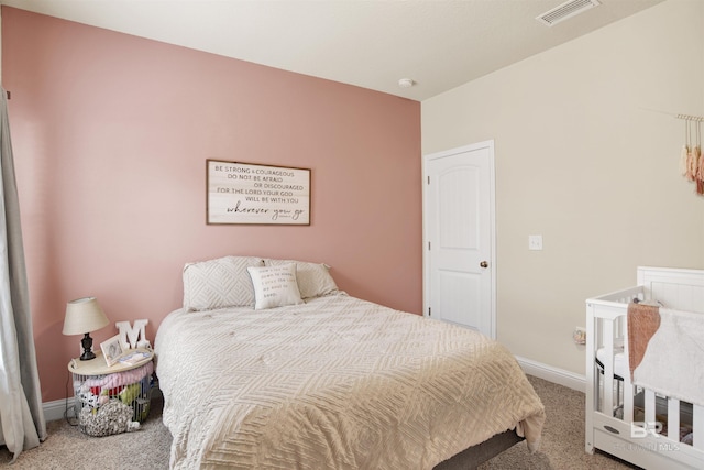carpeted bedroom with baseboards and visible vents
