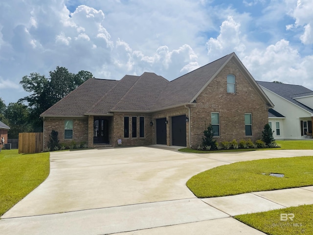 5698 Spring Landing Dr, Theodore, AL 36582 - view of front of property with brick siding, curved driveway, and an attached garage