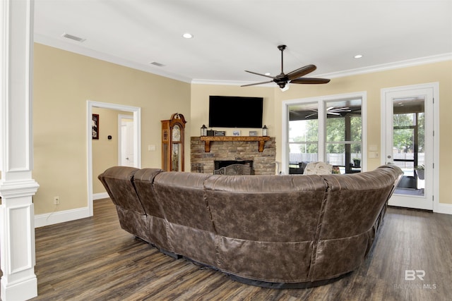 5698 Spring Landing Dr, Theodore, AL 36582 - living room featuring a stone fireplace, ornamental molding, dark wood-type flooring, a ceiling fan, and recessed lighting