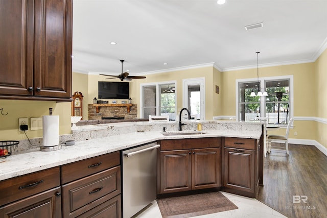 5698 Spring Landing Dr, Theodore, AL 36582 - kitchen with dishwasher, ceiling fan, ornamental molding, light stone counters, and dark brown cabinets