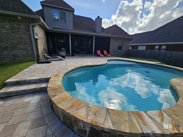 5698 Spring Landing Dr, Theodore, AL 36582 - view of swimming pool with a patio, a sunroom, and a fenced backyard