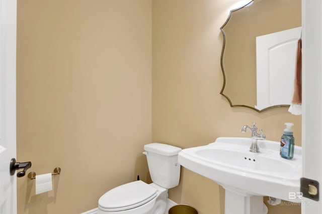 5698 Spring Landing Dr, Theodore, AL 36582 - half bathroom featuring toilet and a sink