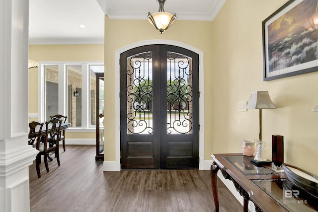 5698 Spring Landing Dr, Theodore, AL 36582 - entrance foyer featuring french doors, arched walkways, wood finished floors, crown molding, and recessed lighting