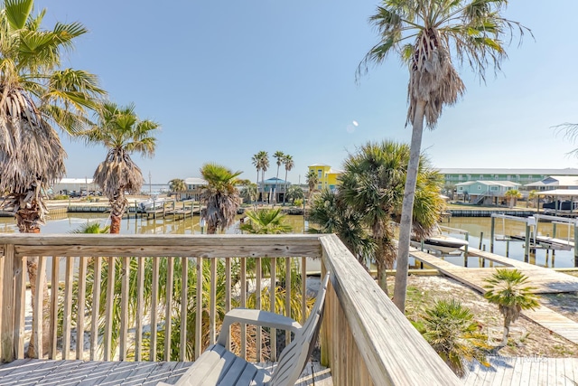 684 Chickasaw Rd, Gulf Shores, AL 36542 - deck featuring boat lift, a water view, and a boat dock