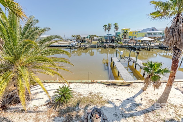 684 Chickasaw Rd, Gulf Shores, AL 36542 - dock with boat lift, a water view, and a residential view
