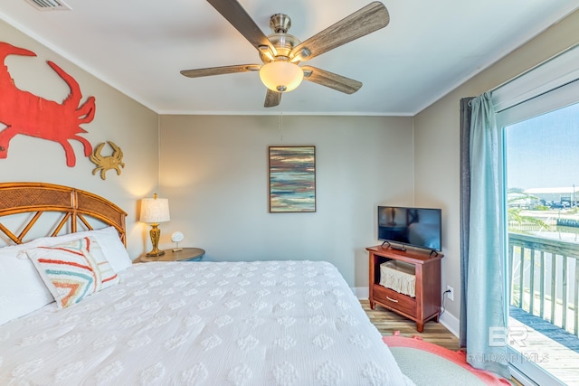 684 Chickasaw Rd, Gulf Shores, AL 36542 - bedroom featuring wood finished floors, access to exterior, crown molding, and a ceiling fan