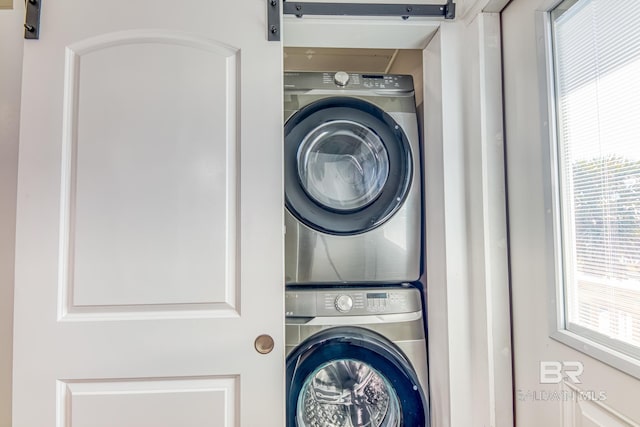 684 Chickasaw Rd, Gulf Shores, AL 36542 - laundry area featuring stacked washer and clothes dryer