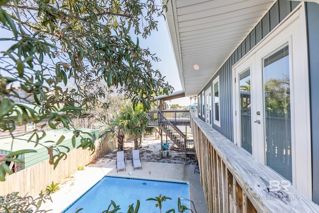 684 Chickasaw Rd, Gulf Shores, AL 36542 - view of swimming pool featuring a fenced backyard, a patio area, stairway, and french doors