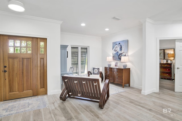 entrance foyer with crown molding, light wood finished floors, recessed lighting, baseboards, and visible vents