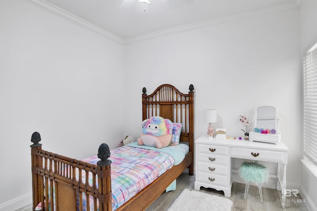 bedroom featuring light wood-style floors, ornamental molding, ceiling fan, and multiple windows