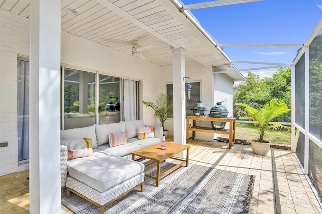 sunroom featuring plenty of natural light and ceiling fan