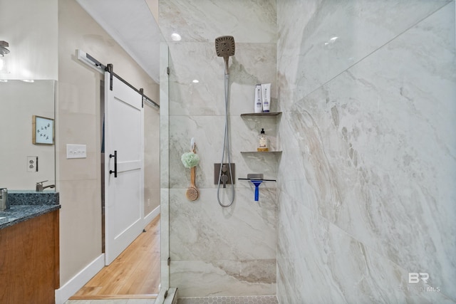 1609 Makaira Dr, Foley, AL 36535 - bathroom with a marble finish shower, vanity, and wood finished floors