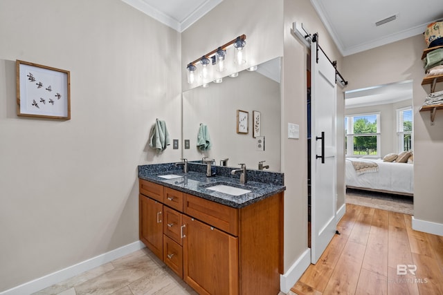 1609 Makaira Dr, Foley, AL 36535 - full bath with ornamental molding, baseboards, connected bathroom, and double vanity
