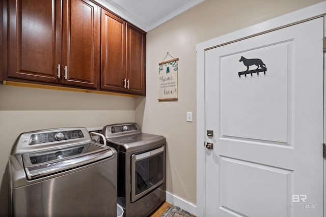 1609 Makaira Dr, Foley, AL 36535 - laundry area featuring independent washer and dryer, cabinet space, baseboards, crown molding, and light wood finished floors