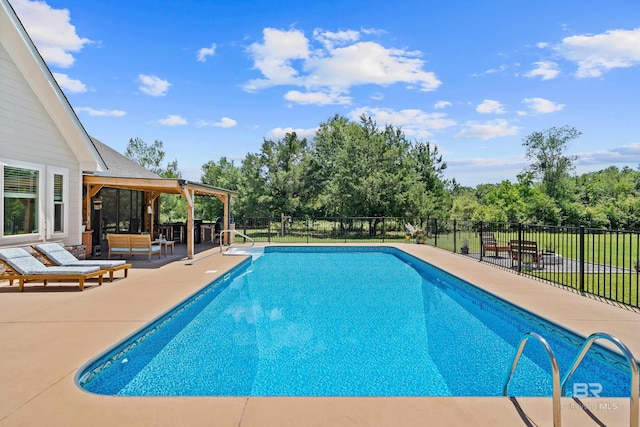 1609 Makaira Dr, Foley, AL 36535 - view of swimming pool with an outdoor living space, a patio area, and view of wooded area