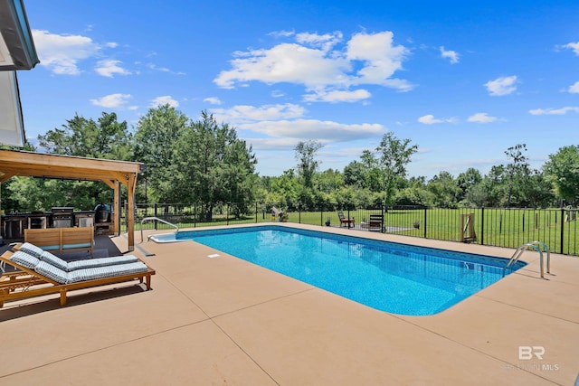 1609 Makaira Dr, Foley, AL 36535 - view of pool featuring a patio, exterior kitchen, and view of scattered trees