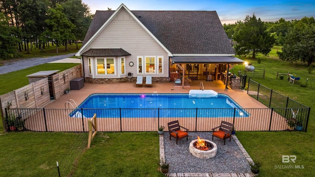 1609 Makaira Dr, Foley, AL 36535 - view of pool with an outdoor fire pit and a patio area