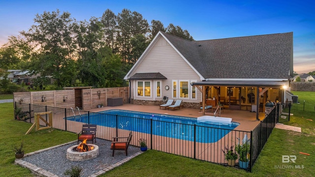 1609 Makaira Dr, Foley, AL 36535 - pool at dusk featuring a fire pit, a patio, and central AC unit