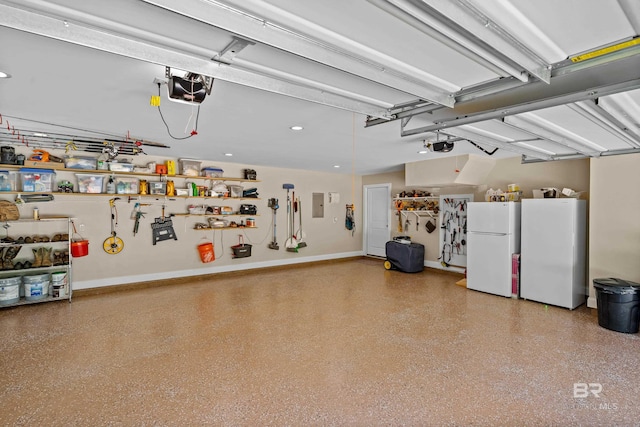 1609 Makaira Dr, Foley, AL 36535 - garage featuring freestanding refrigerator, a garage door opener, and electric panel