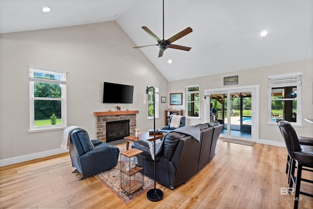 1609 Makaira Dr, Foley, AL 36535 - living room with a ceiling fan, high vaulted ceiling, a fireplace, light wood-style floors, and recessed lighting