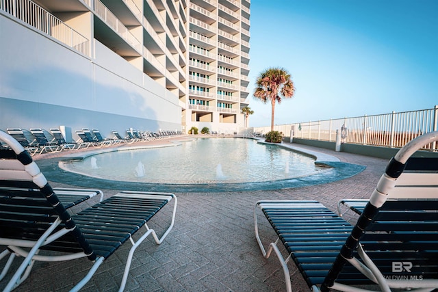 view of pool with fence