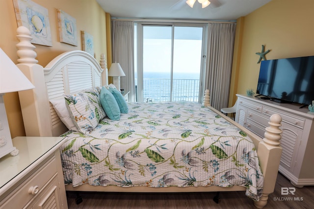 bedroom with access to exterior, ceiling fan, and wood finished floors